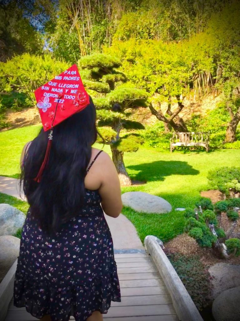 Angie O.'s red graduation cap