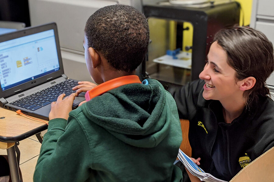 A student at School on Wheels' Skid Row Learning Center works with staff member Emma Gersh in February 2021.