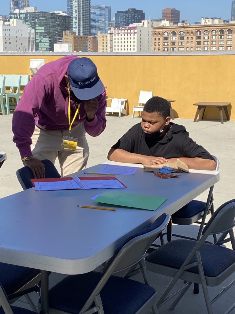 Tutor and male student on Union Rescue Mission rooftop